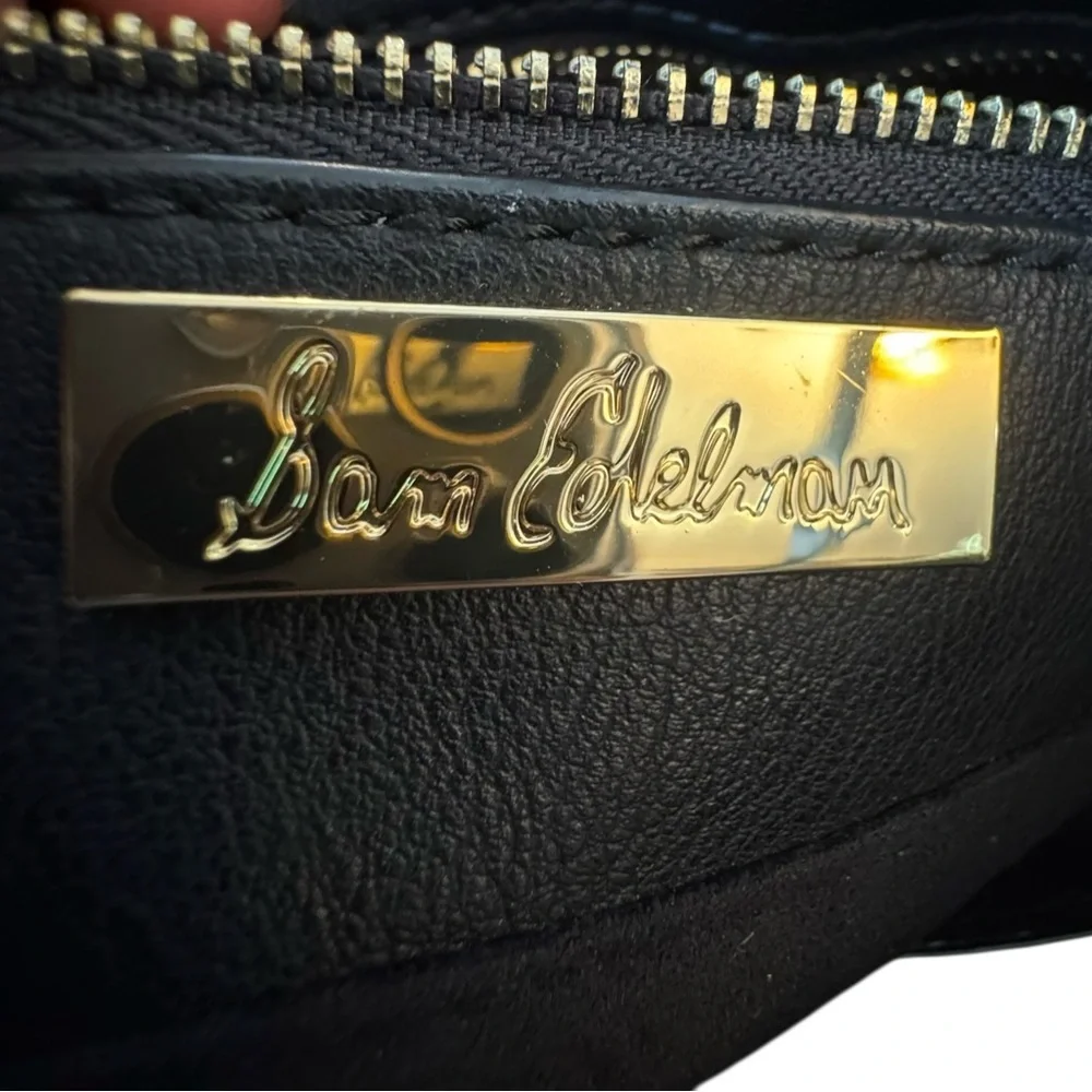Sam Edelman Faux Leather Black and Silver Eyelet Wristlet Bag